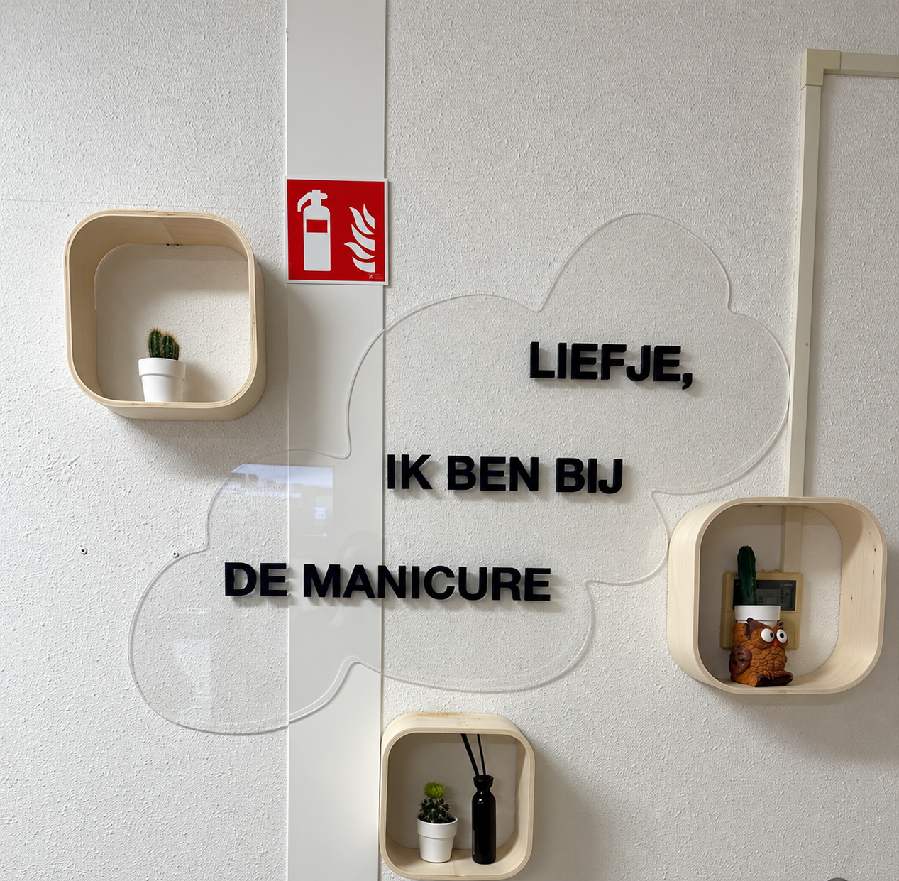 Installed manicure studio wall sign with a transparent cloud outline