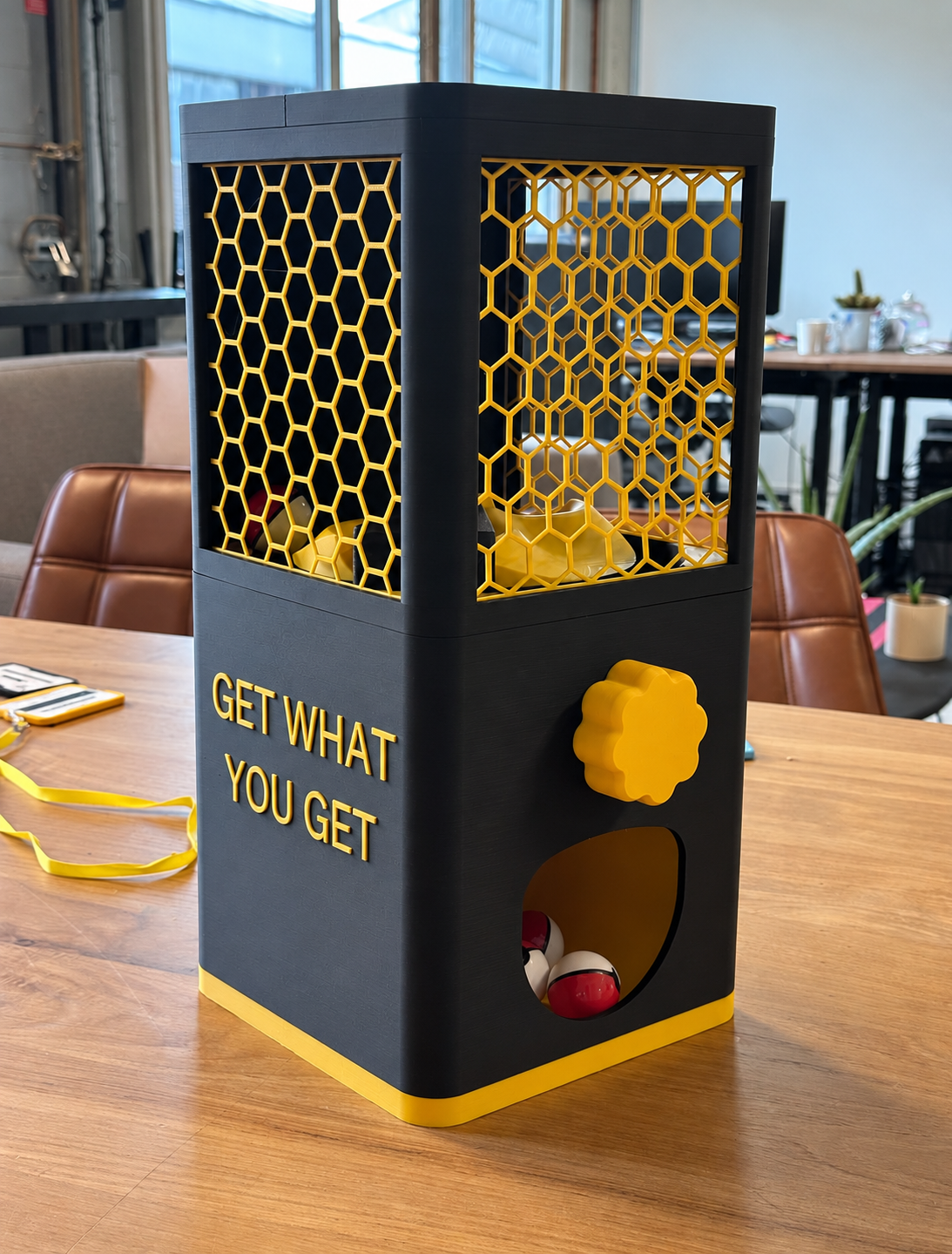Black and gold 3D-printed gacha capsule machine