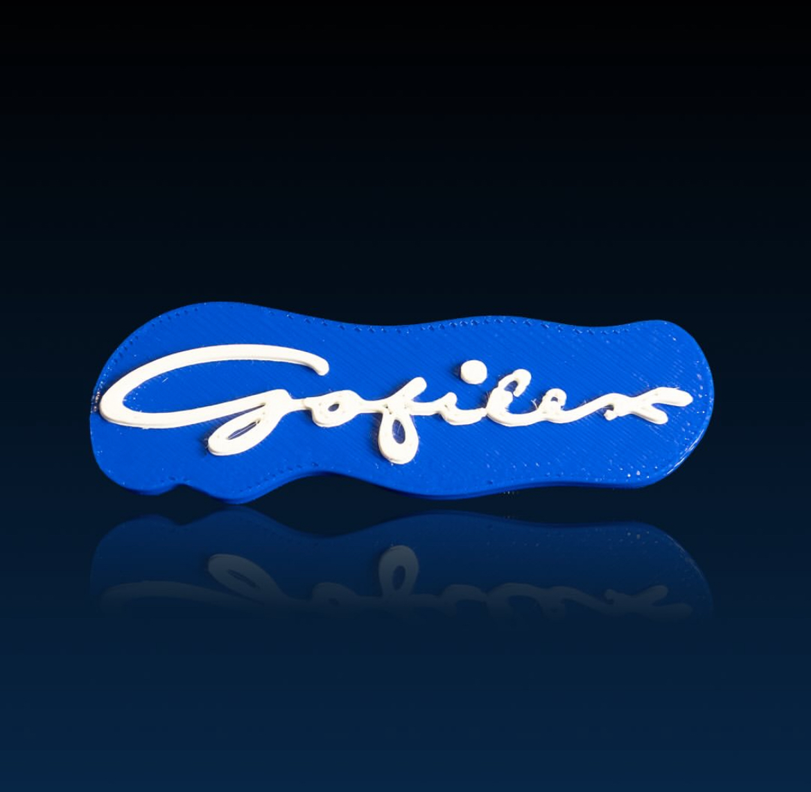 Blue Gofilex badge with raised white lettering