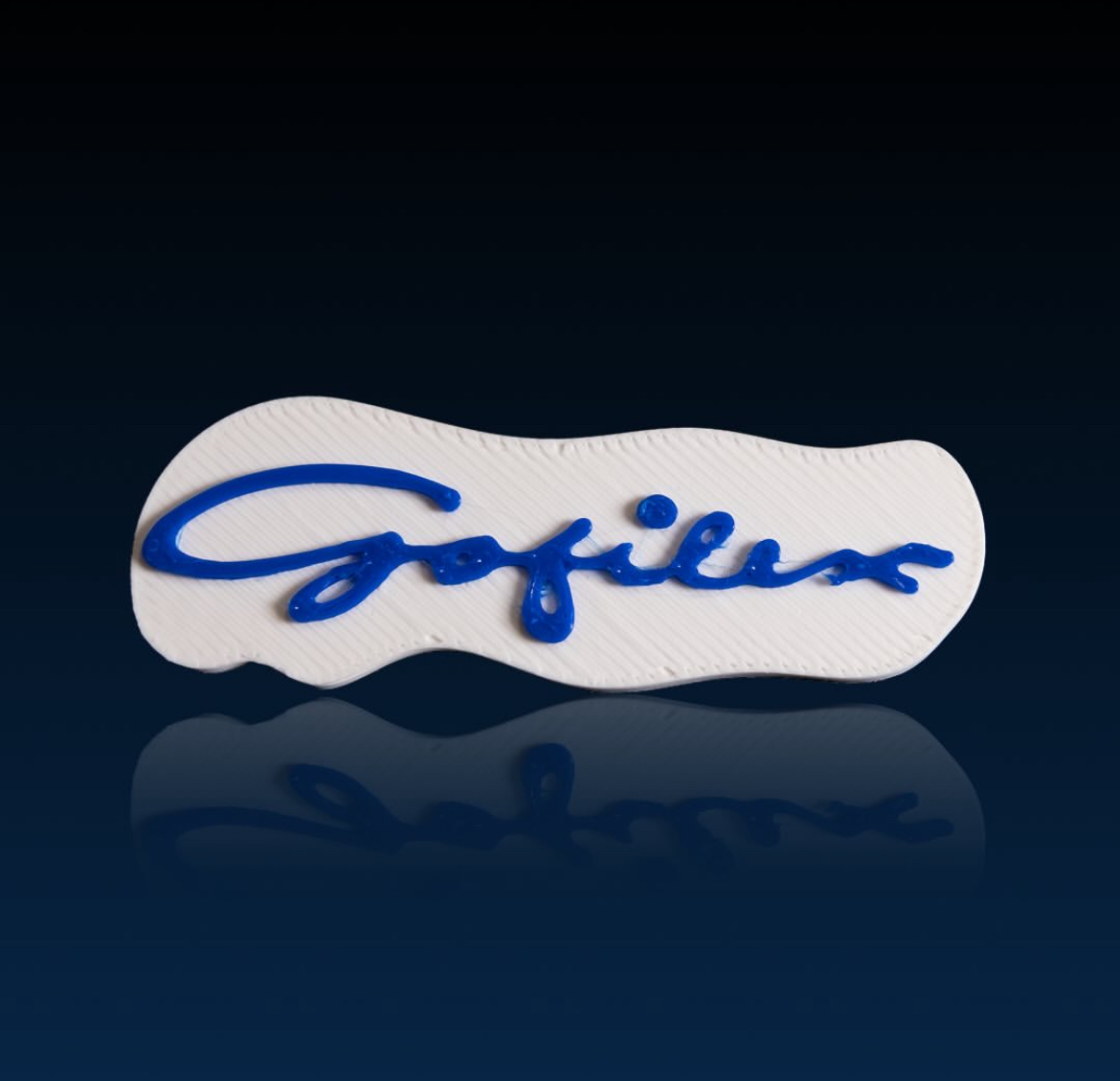 White Gofilex badge with raised blue lettering