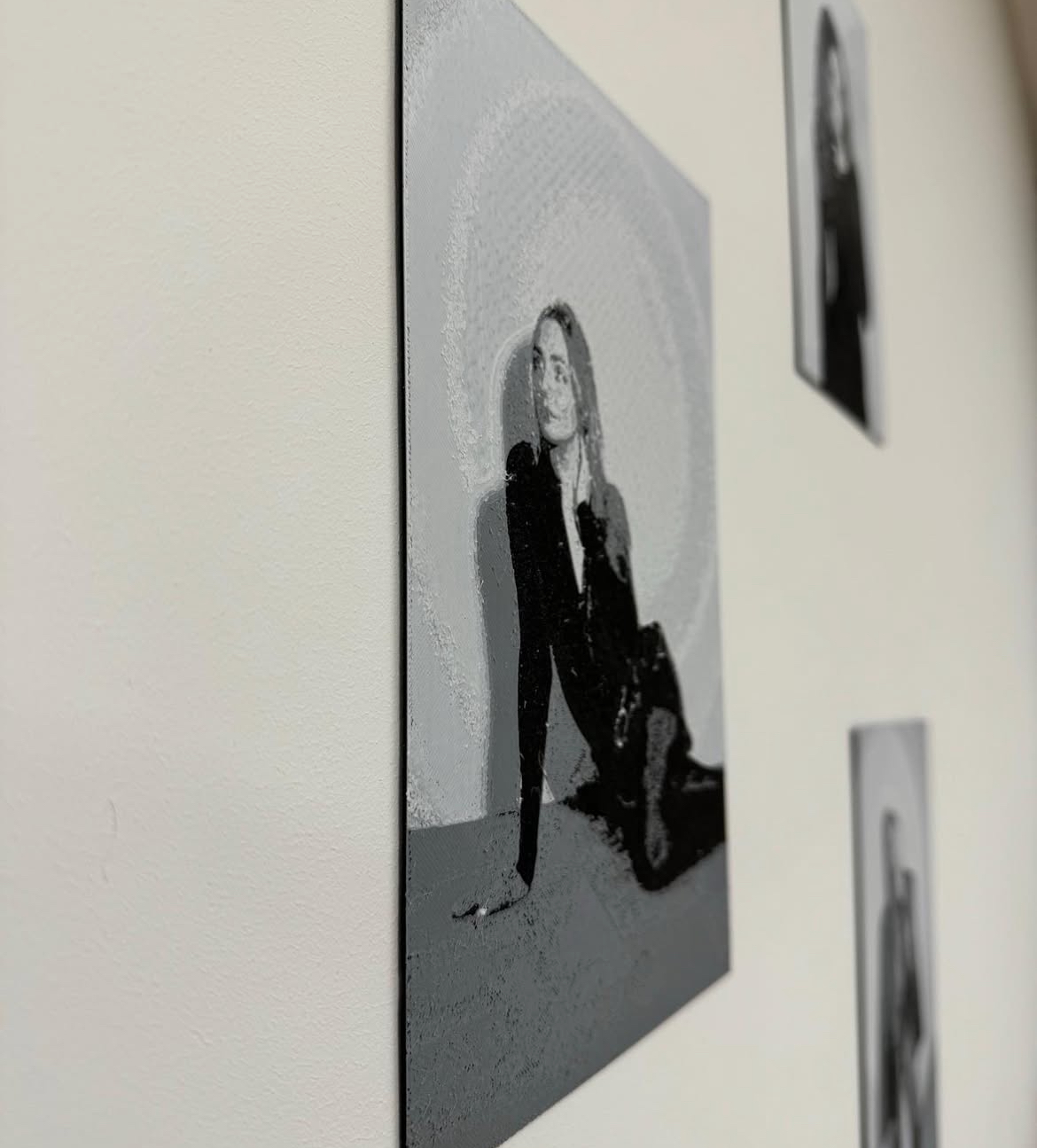 Side view showing the raised texture of a 3D-printed portrait canvas