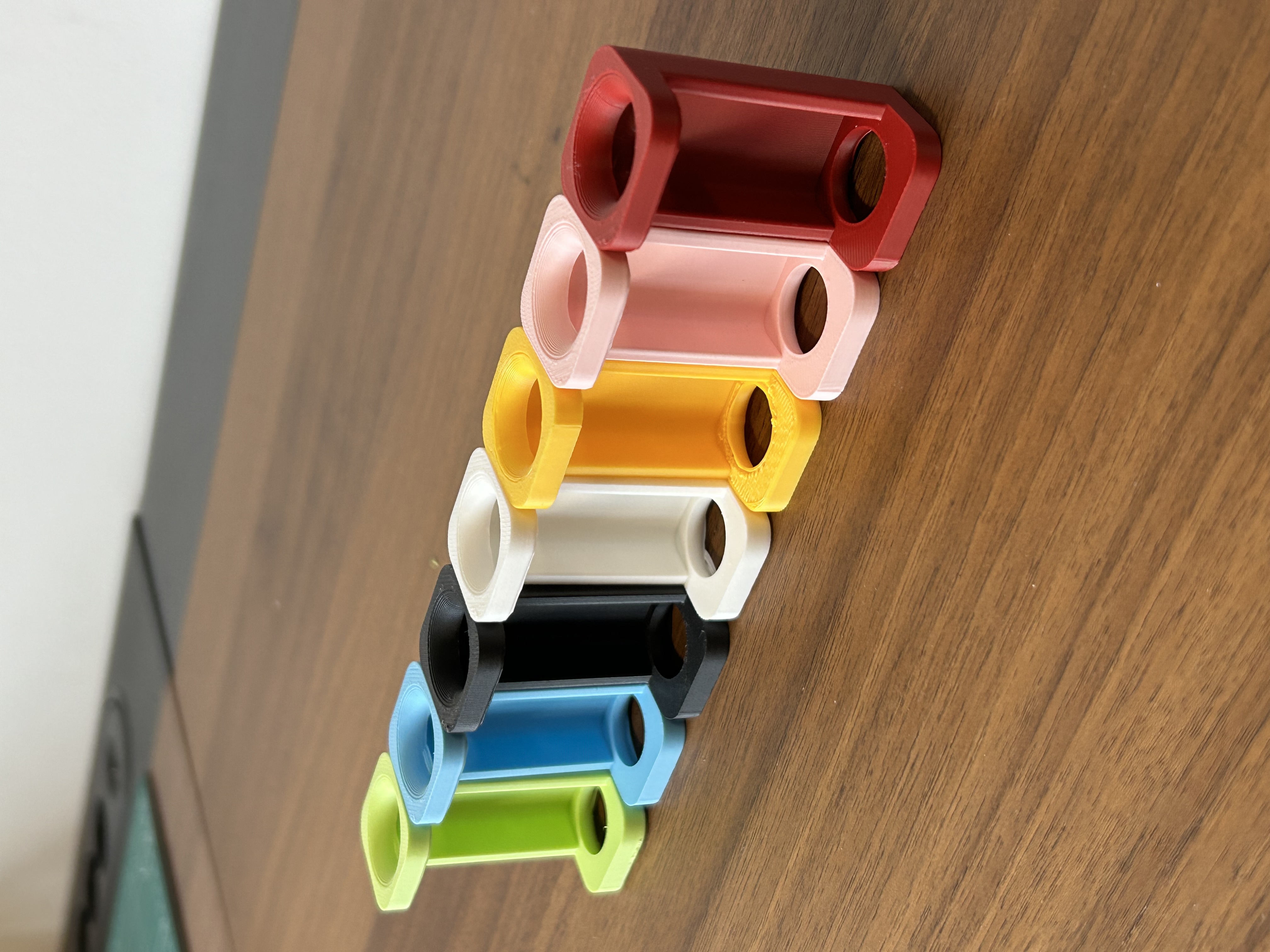 Angled view of Flacon Holders in all available colours